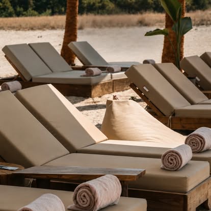 Sun loungers with rolled towels at COCO